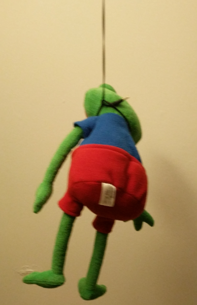 pepe plush toy hanging by string noose suicide